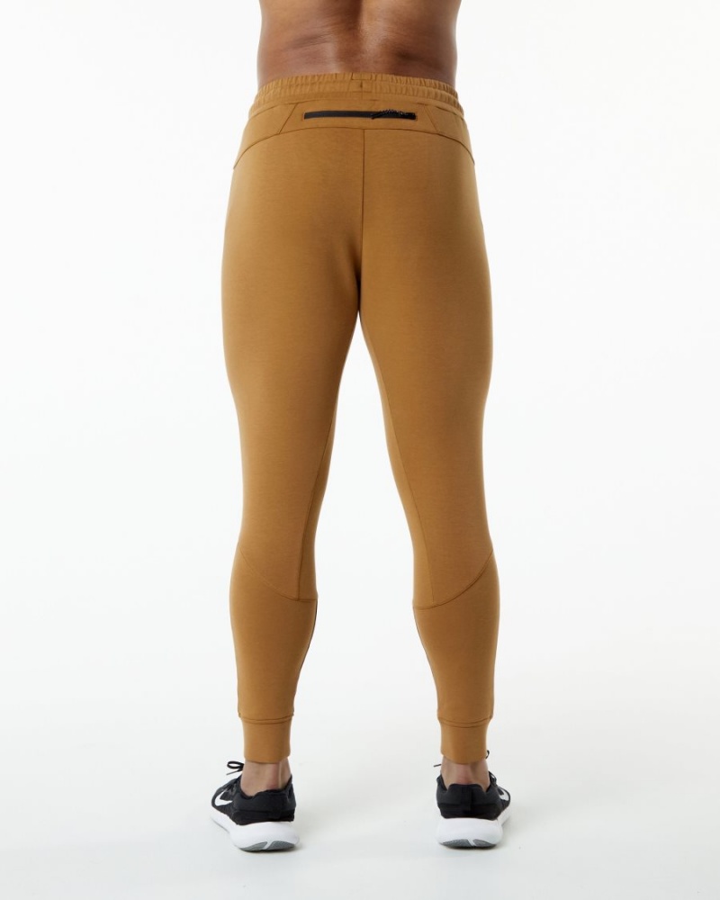 Pantalones Jogger Alphalete ELMTS Cuffed Jogger Hombre Almond | CNHIWA-176