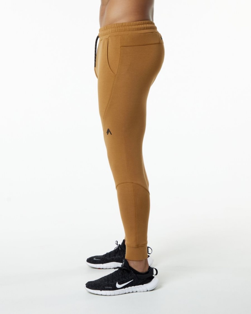 Pantalones Jogger Alphalete ELMTS Cuffed Jogger Hombre Almond | CNHIWA-176