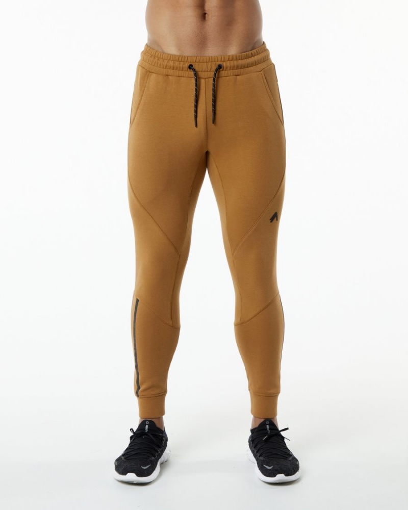 Pantalones Jogger Alphalete ELMTS Cuffed Jogger Hombre Almond | CNHIWA-176